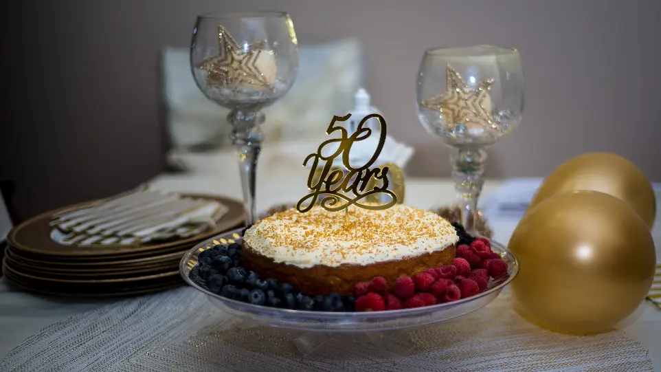 brown and white cake on black and white ceramic plate